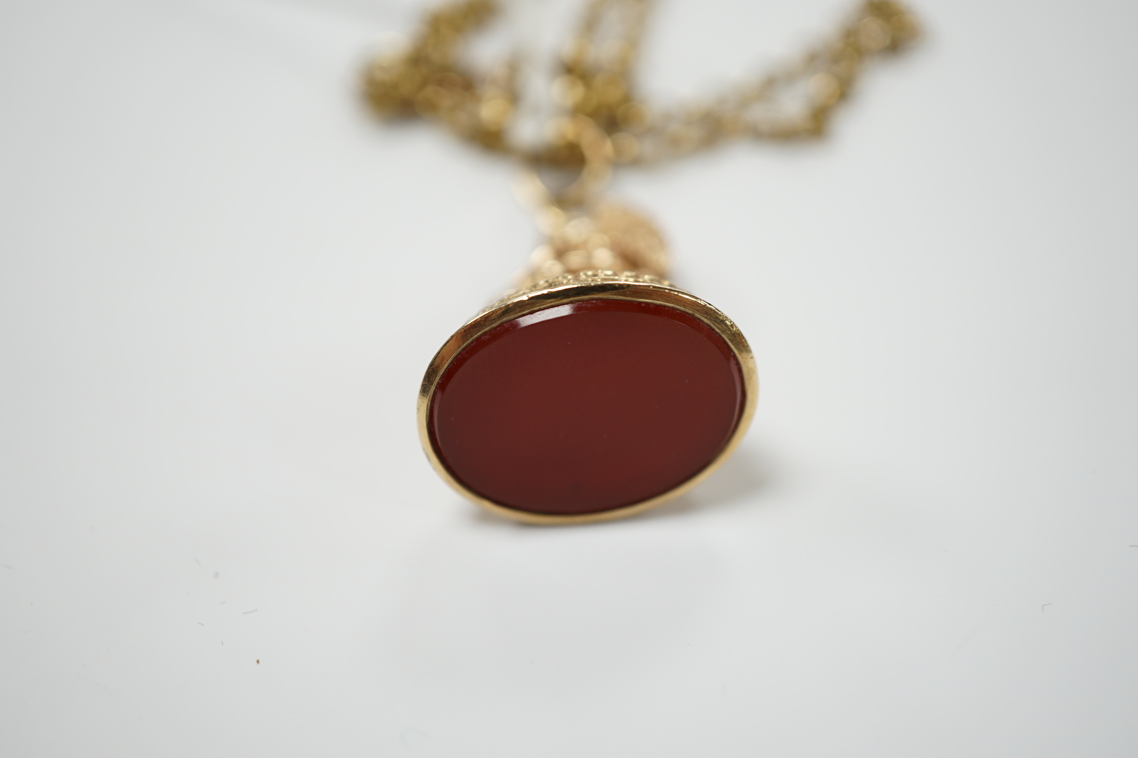 A 1960's 9ct and carnelian set fob seal, on a 9ct chain